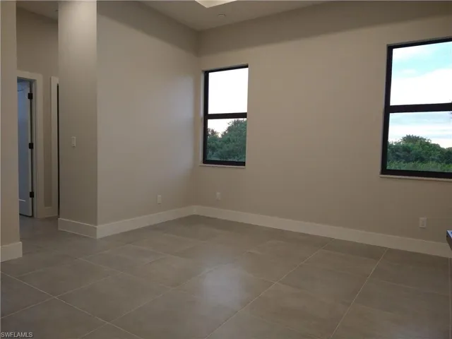 Empty room featuring tile patterned flooring