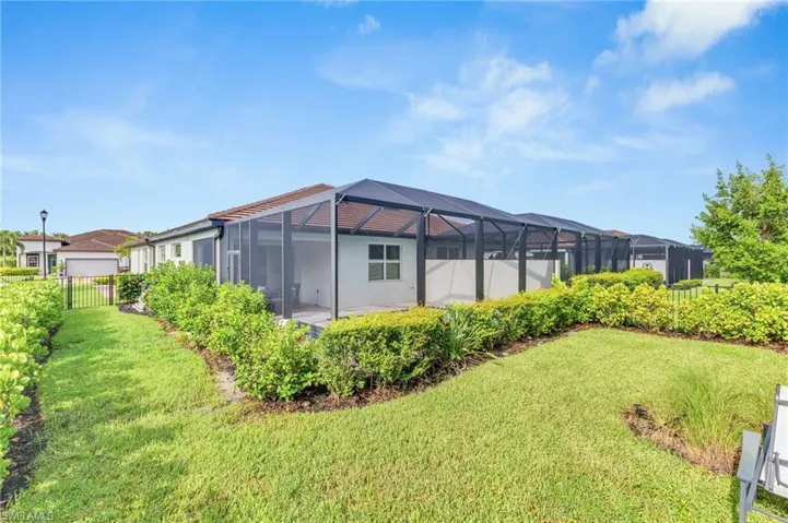 View of yard featuring glass enclosure