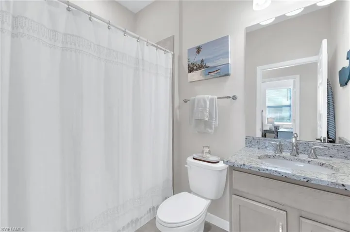 Full bathroom featuring vanity and toilet