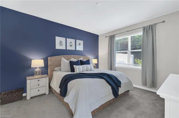 Carpeted bedroom with baseboards