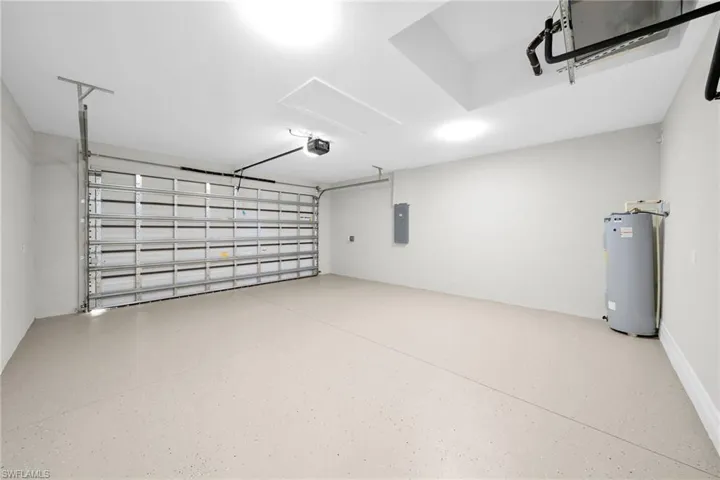 Garage with a garage door opener and water heater