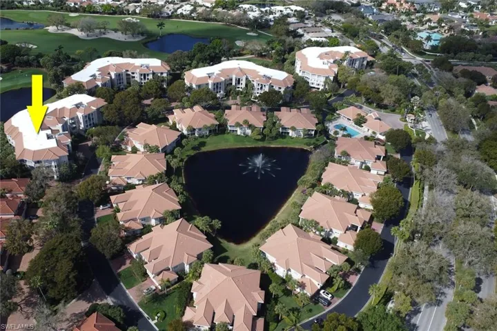 Aerial overview of property's location featuring a nearby body of water and nearby suburban area