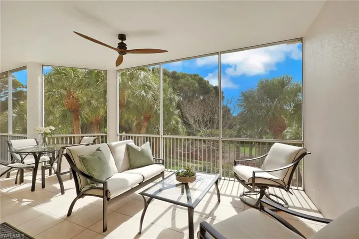 Sunroom with a ceiling fan and an outdoor hangout area