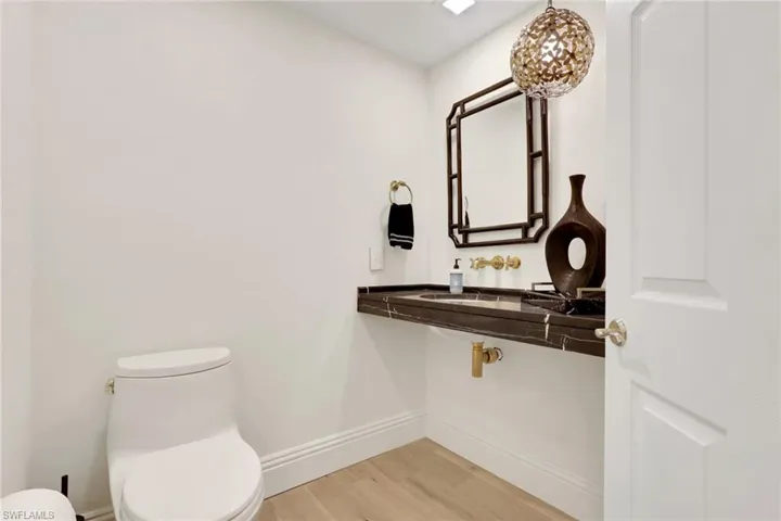Bathroom with real wood flooring and vanity