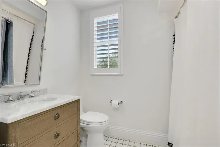 Full bathroom featuring vanity and a shower with curtain