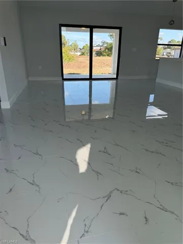 Unfurnished room with plenty of natural light