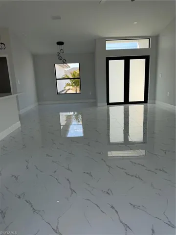 Unfurnished room with baseboards