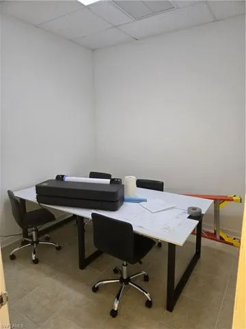 Tiled office space with a drop ceiling