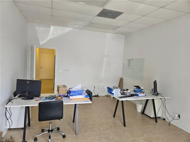 Tiled office with a drop ceiling