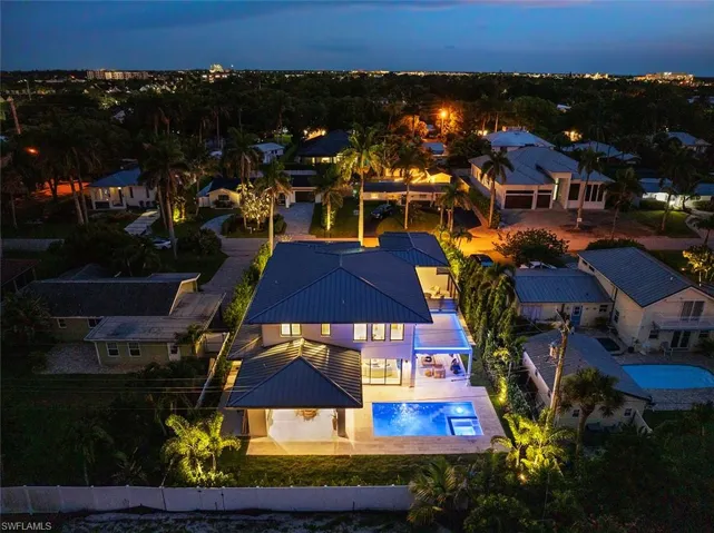 View of subject property with a pool area