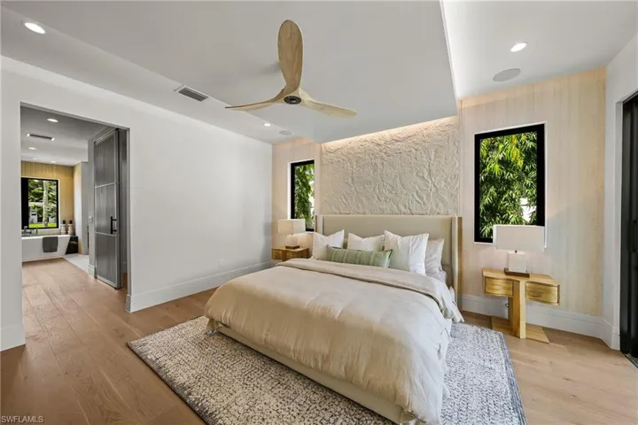 Bedroom with recessed lighting, light wood-type flooring, and a ceiling fan