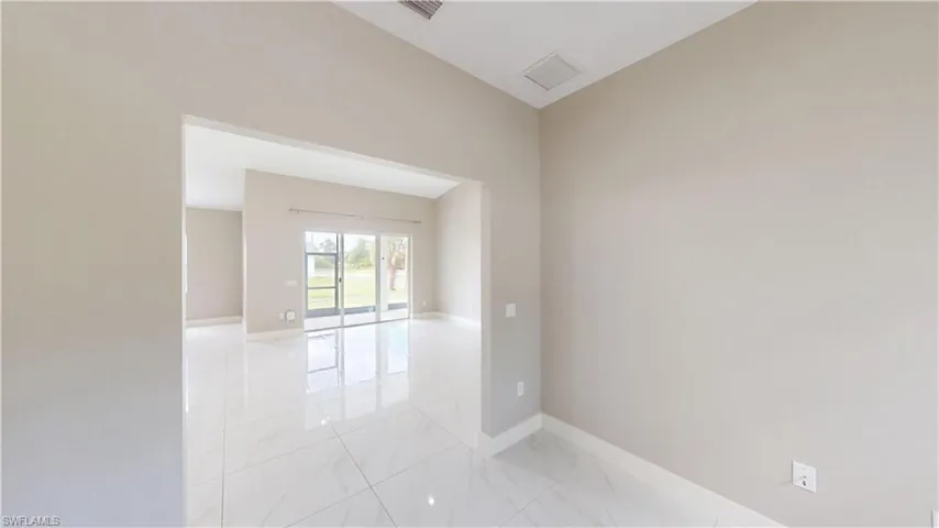 Empty room with light marble finish floors and baseboards