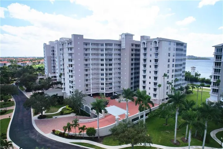 View of  building / complex featuring a water view