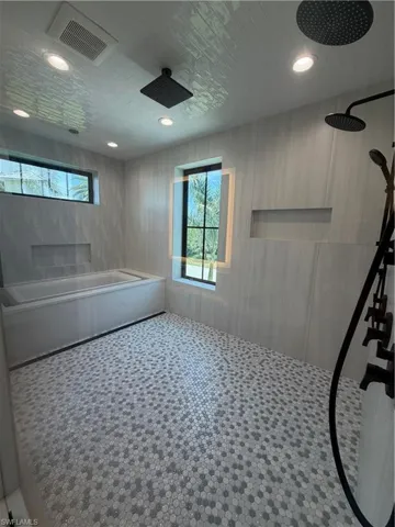Wet room with soaking tub and shower
