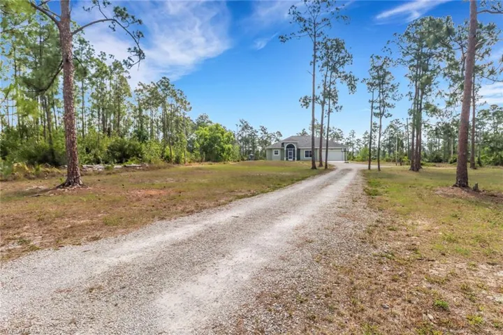 View of street with gravel driveway