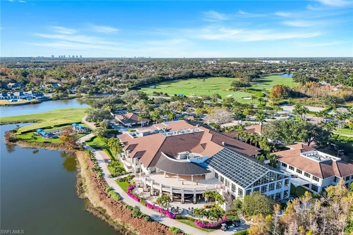 Clubhouse - Drone / aerial view of a nearby body of water and a golf course
