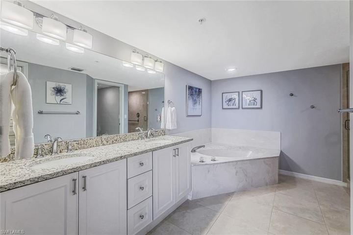 Gorgeous soaking bath, dual sinks and granite countertops.