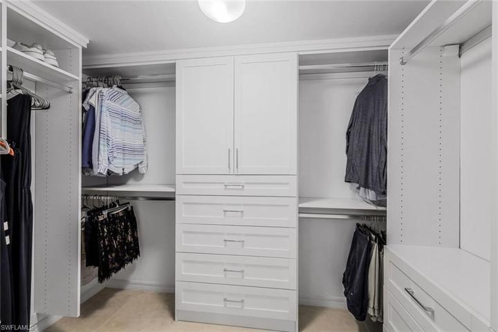 Custom closet system in primary bedroom.