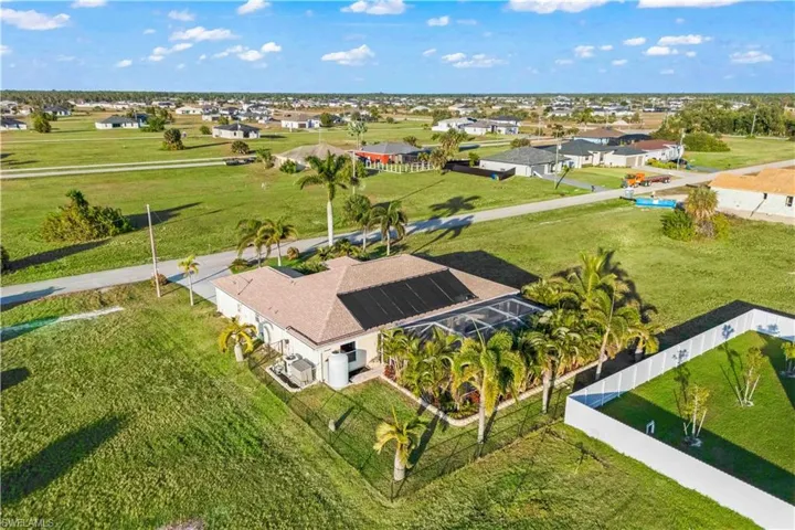 Lush, mature landscaping surrounds the pool, creating a private and serene tropical retreat right in your backyard.