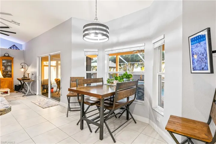 Warm and welcoming dining space overlooking the pool and lanai.