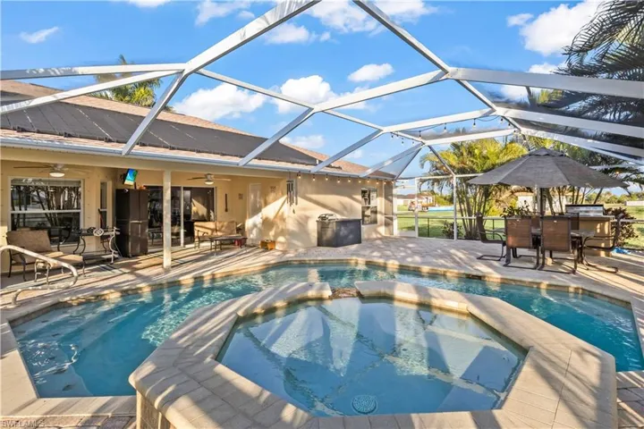 Your own private oasis—sparkling in-ground pool and relaxing spa surrounded by mature tropical landscaping.