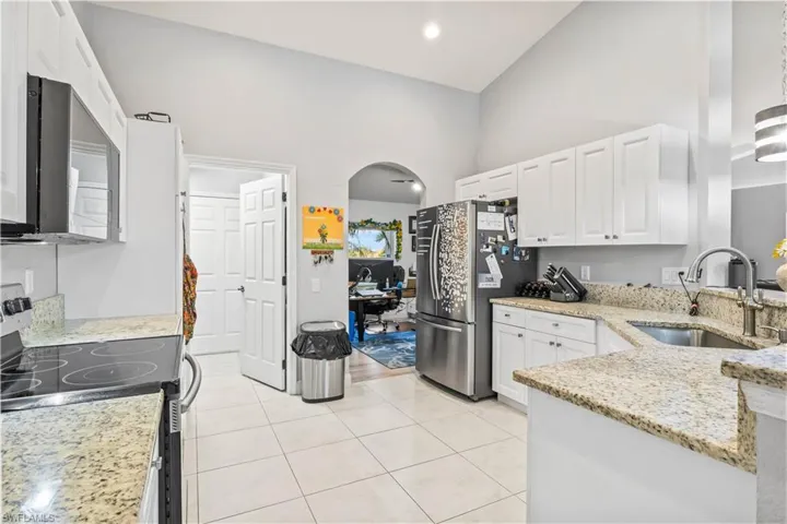 Open and spacious kitchen with access to laundry room and formal dining/flex room.