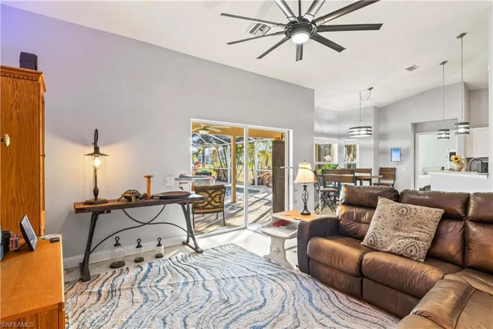 Open floor plan moves beautifully to the outdoor covered seating area on the lanai.