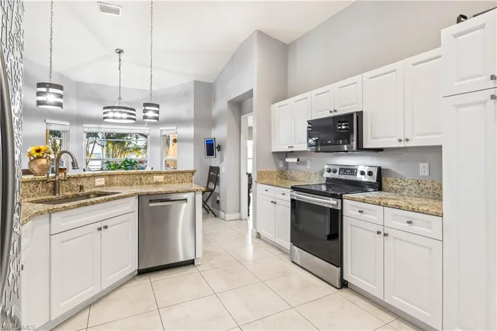 Kitchen features spacious countertops, modern appliances, and plenty of storage—perfect for preparing meals for family and friends.