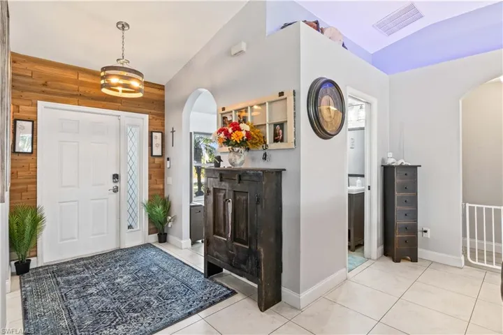 Left side of entryway is a den/office/flex room and a perfectly placed half bath.