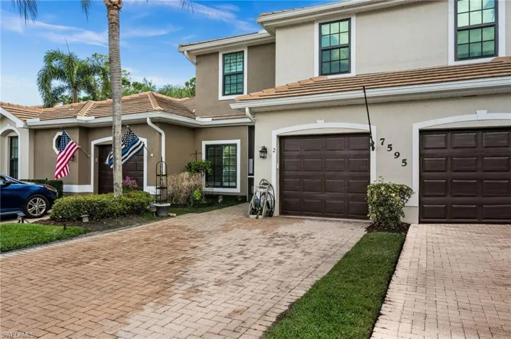 Long pavered driveway and 1 car garage