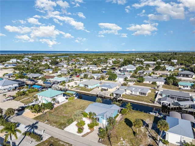 Aerial view of residential area with a large body of water