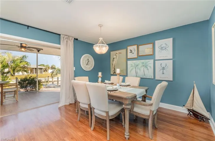 Dining space with light wood-style floors