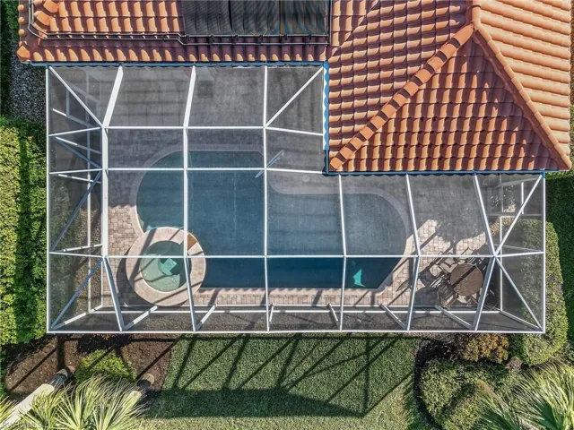 View of side of property with a lanai