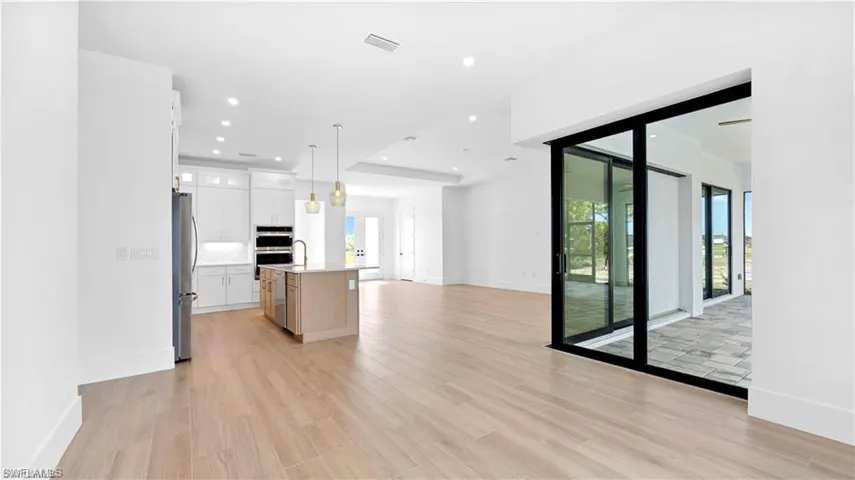 Unfurnished living room with light hardwood / wood-style flooring