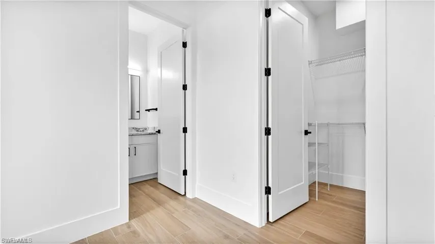Hallway featuring light wood-type flooring