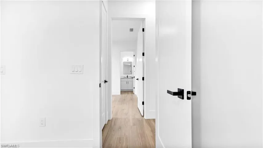 Hall featuring light hardwood / wood-style flooring