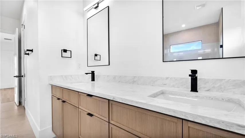 Bathroom with tile patterned flooring and vanity