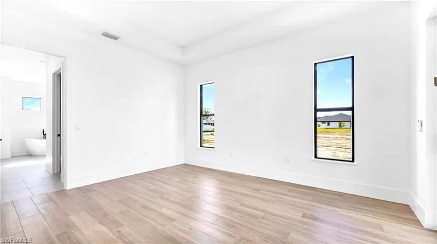 Empty room with light wood-type flooring