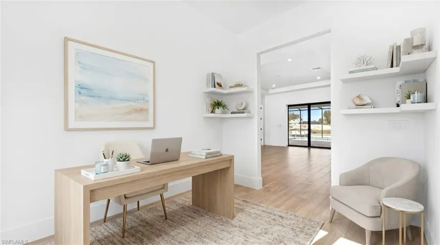 Dedicated interior space featuring wood-finish flooring and bright white walls