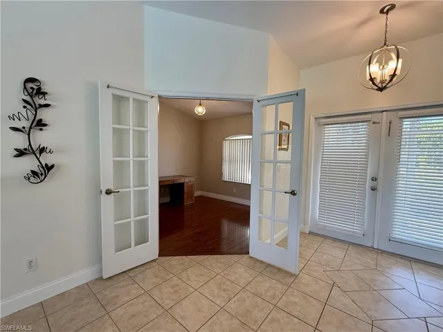 Doorway to outside and french doors to office