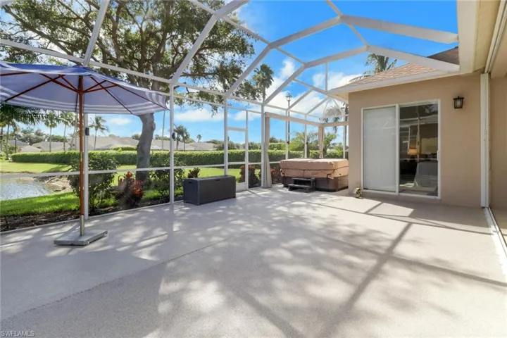 Lanai is featuring hot tip conveniently off Primary bedroom slide glass door, under a cage with plenty of room to decorate, exercise, or play in a safe space.