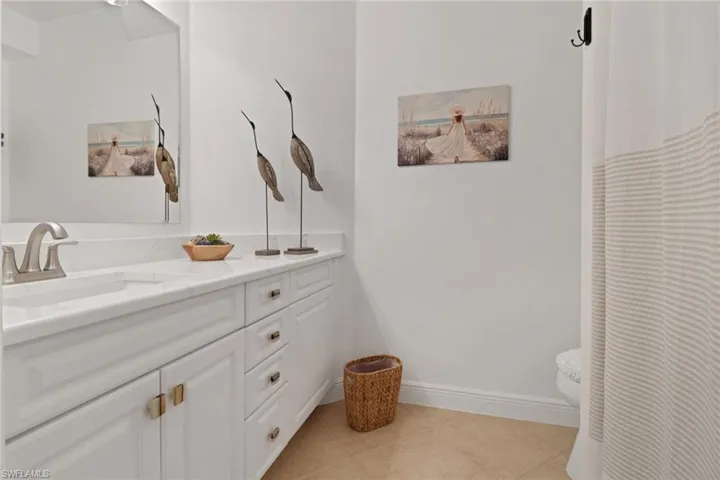 Full bathroom with easy access to other areas of the house for guests