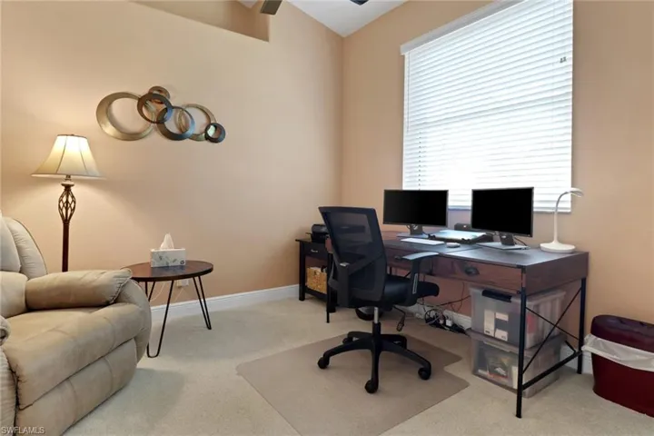 Den space with new light colored carpet, high ceilings and makes a private get-a-way to watch a football game.