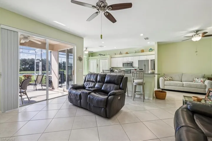 Living room with light tile patterned flooring