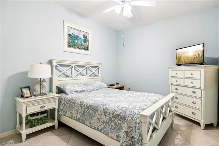 Bedroom featuring ceiling fan and light tile patterned flooring