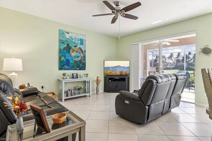 Tiled living room with ceiling fan