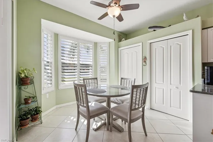 Tiled dining area with ceiling fan