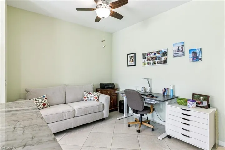 Tiled home office with ceiling fan