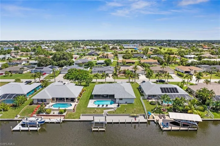 Back of the home with new dock and lift