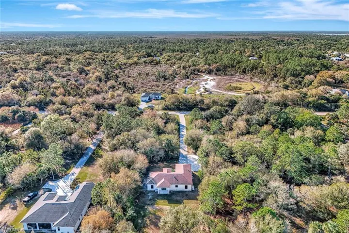 Aerial overview of property's location with a forest